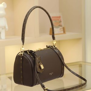 Alternative view of 17 x 13.5 x 26 cm (H x W x L) Cowhide-coated canvas trim Cotton lining Metal hardware Dual zipper closure Removable key pouch and detachable padlock (attaches to zipper pull) Shoulder strap:Removable, adjustable Strap half-length: 41.0 cm Adjustable to: 47.0 cm Handles: Dual handles